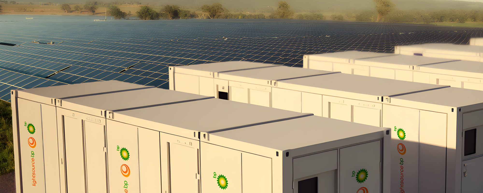 A digital render depicting a row of Lightsource bp branded large white energy storage containers, positioned in front of an extensive solar panel array under a clear sky, a solar energy storage facility.